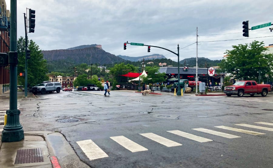 People crossing the empty 11th Street in downtown Durango