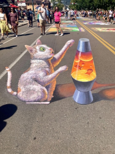 View of a 3D chalk art by Chris Carlson during the Denver Chalk Art Festival in Colorado