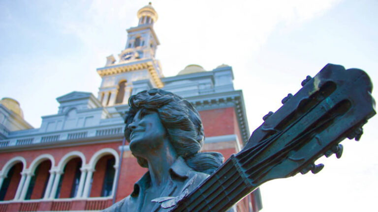 View of the Dolly Parton statue holding a guitar at the Sevierville Courthouse