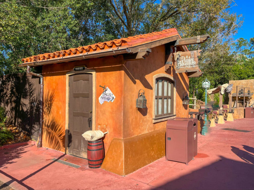 A small building and a wooden barrel, part of A Pirate's Adventure