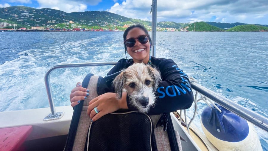 The author's wife and dog riding on the boat