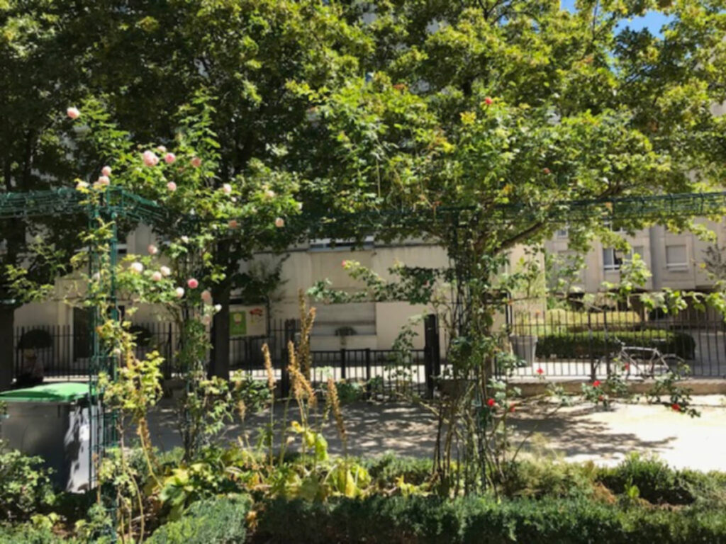 A garden surrounded by lush greenery