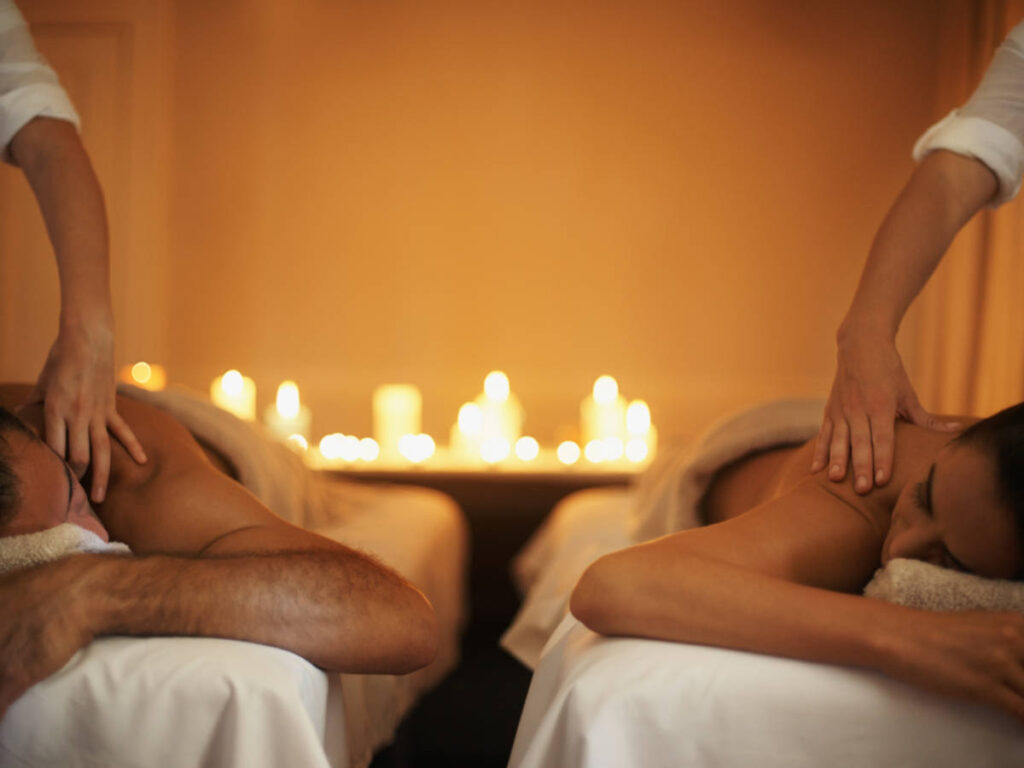 A couple getting relaxed during a massage in AIRE Ancient Baths Chicago