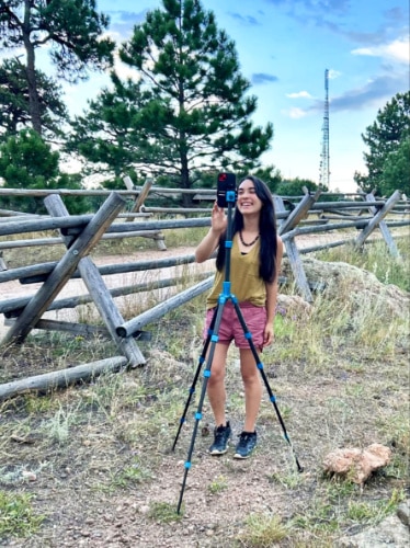 The author Abigail Bliss, using the mobile phone mounted on the Benro MeFOTO Roadtrip PRO Carbon Fiber Tripod