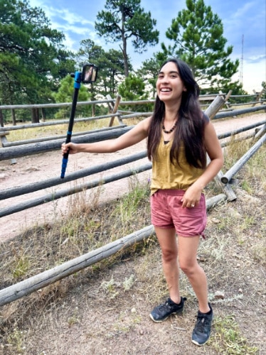 The author Abigail Bliss, using the MeFOTO Roadtrip PRO as a selfie stick