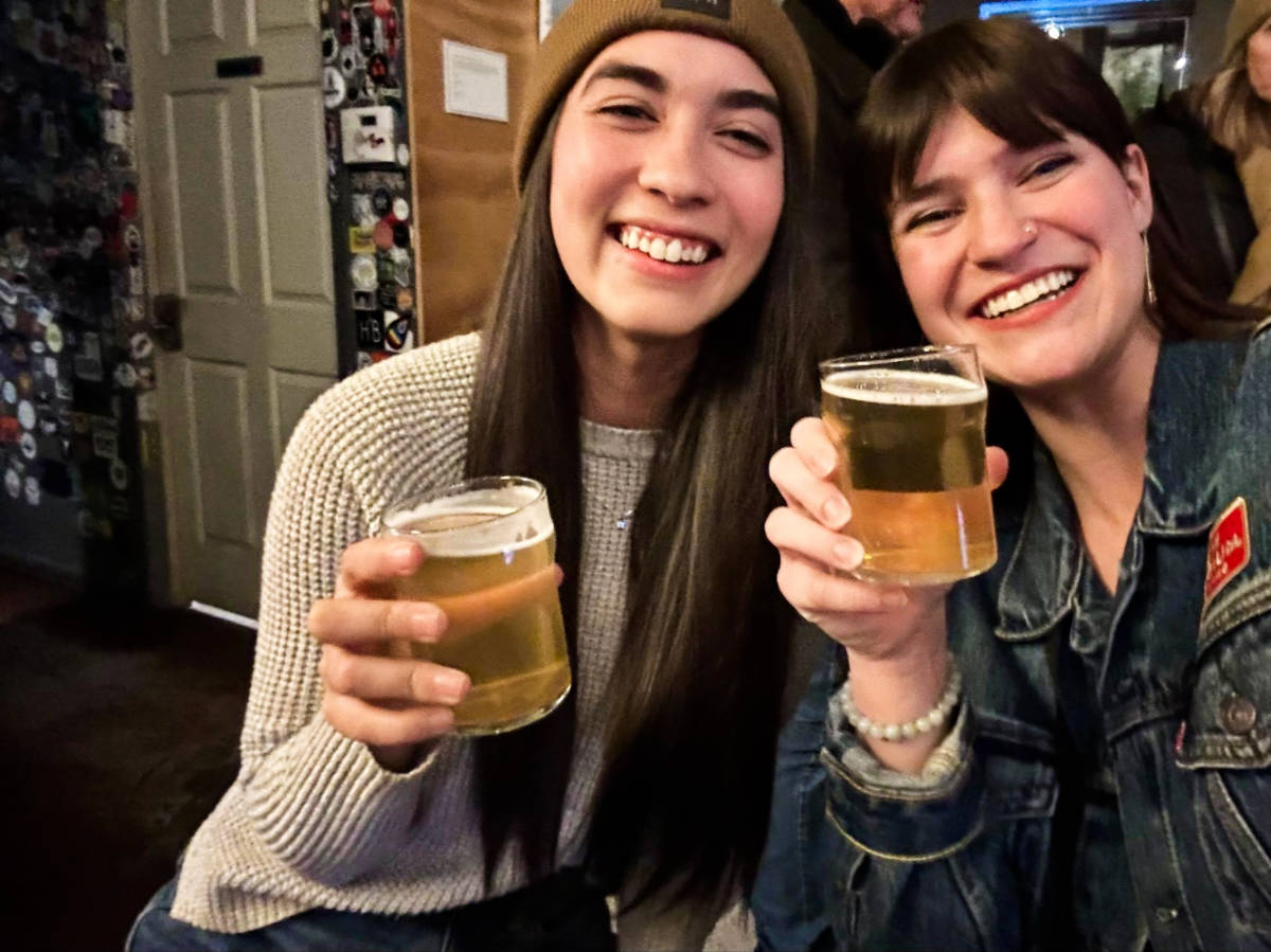 Travel Lemming Writer Betty Hurd and Abigail Bliss, posing for a photo with their glasses of beer in Denver