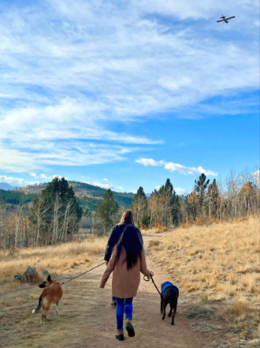 Travel Lemming editor Abigail Bliss, walking along with her family at the colorful forest and mountain views