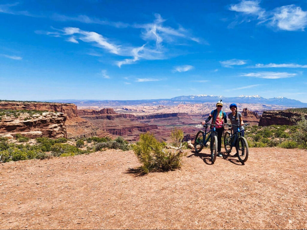 Travel Lemming editor Abigail Bliss and her friend mountain biking at Dead Horse Point State Park