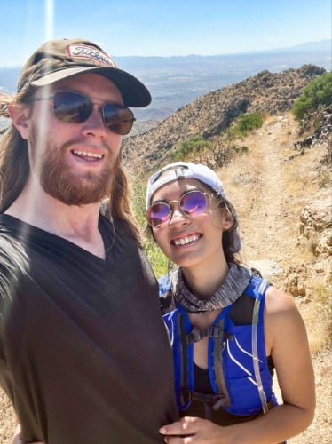 Travel Lemming Editor Abigail Bliss with her husband, posing for a photo at Saguaro National Park