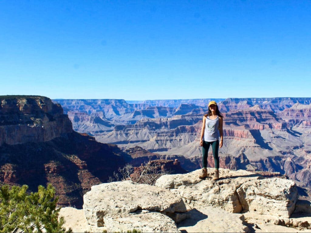 Travel Lemming Editor Abigail Bliss, posing for a photo at the south rim of the Grand Canyon National Park