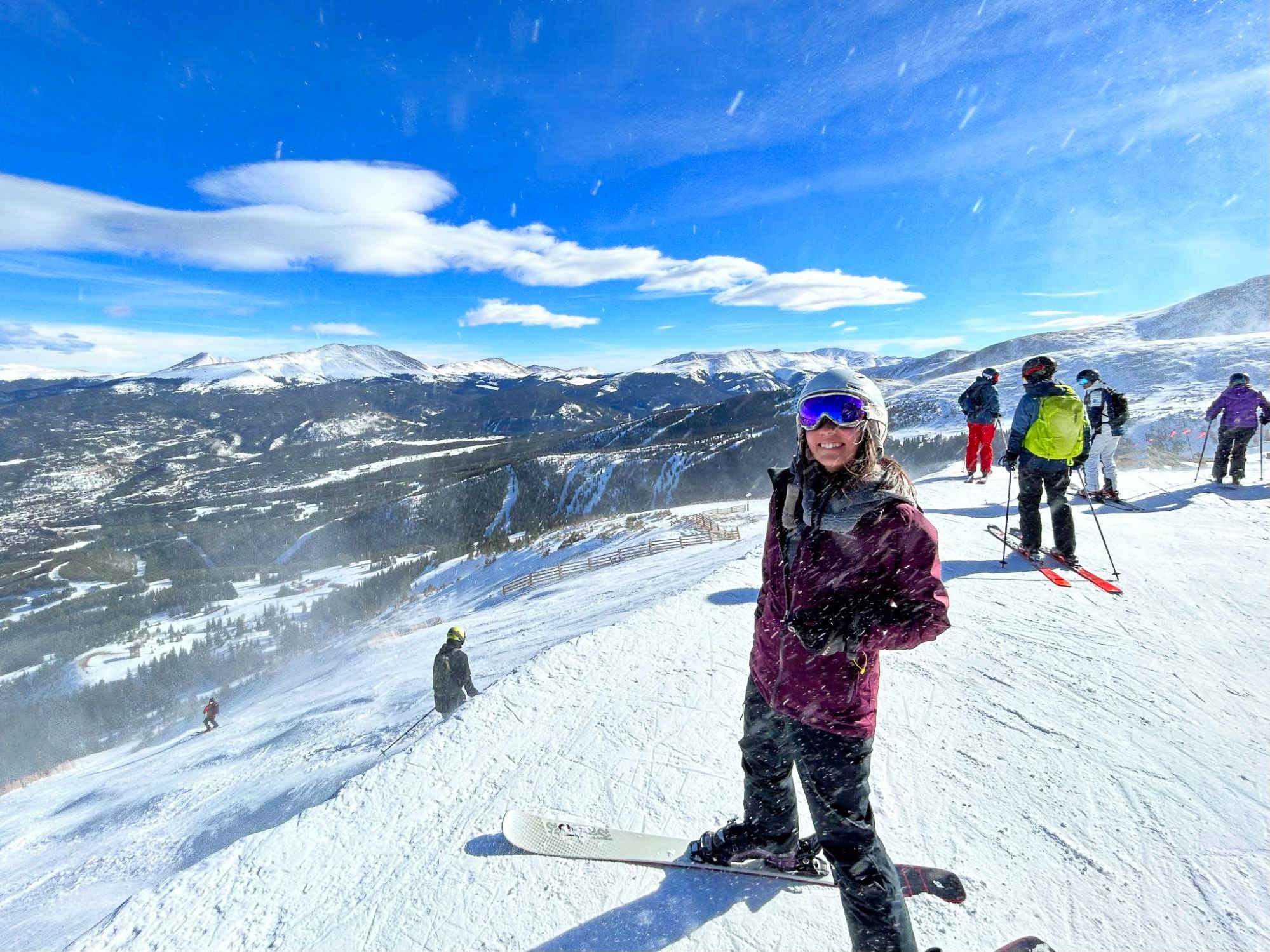 Travel Lemming Editor Abigail Bliss, posing for a photo at the top of Horseshoe Bowl at Breckenridge Ski Resort 