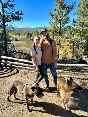 Travel Lemming editor, Abigail Bliss with her husband and their dogs in Nederland