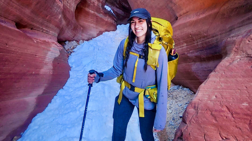 The author, Abigail, hiking in Utah using the REI Co-Op Flash 55 Backpack