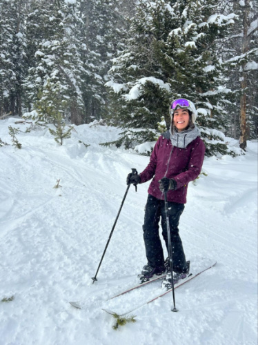 The author Abigail skiing at Breckenridge Ski Resort