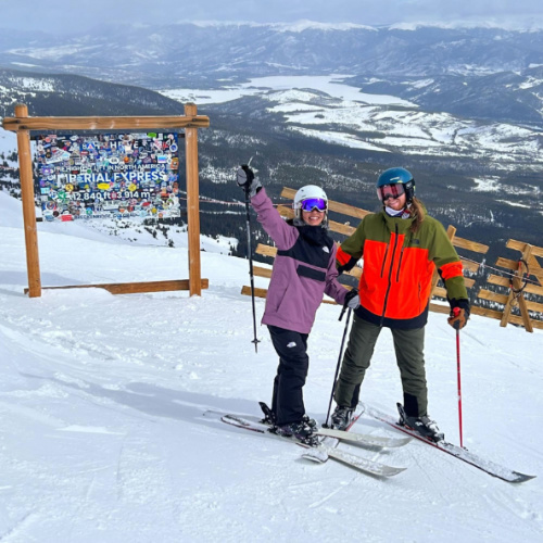 The author Abigail Bliss and her husband posing for a photo at the ski resort