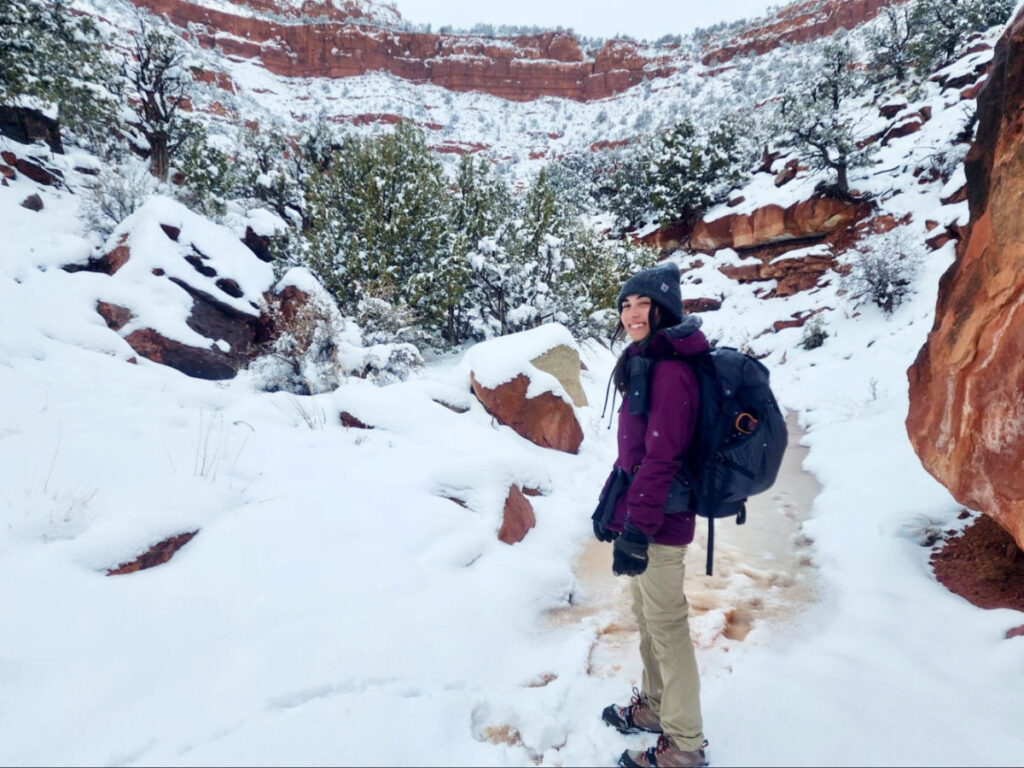 The author, Abigail, posing while carrying the Hyperlite Mountain Gear Southwest Backpack in winter