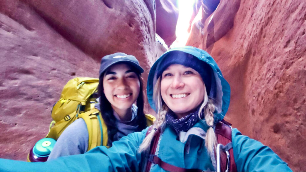 The author, Abigail, and her friend posing on their hike in Utah