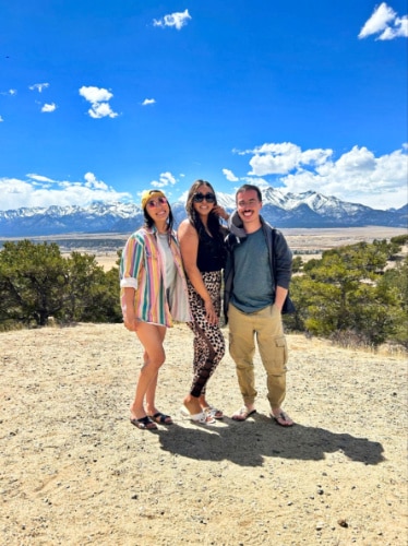 Travel Lemming editor Abigail and her friends, posing at the Collegiate Peaks Scenic and Historic Byway on a sunny day