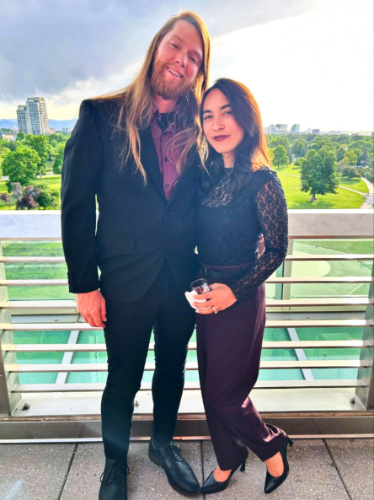 Travel Lemming editor Abigail Bliss and her husband on a formal attire at the Denver Museum of Nature & Science