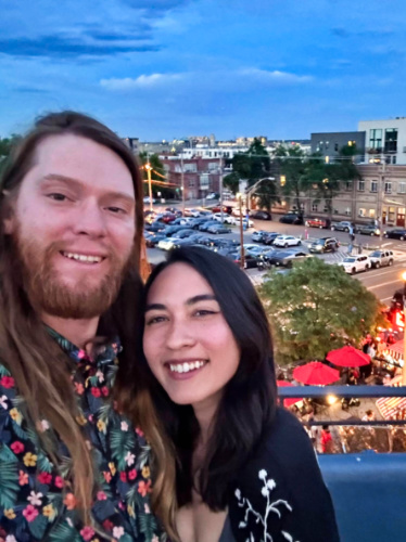 Travel Lemming editor Abigail and her husband posing for a photo at the rooftop of Linger