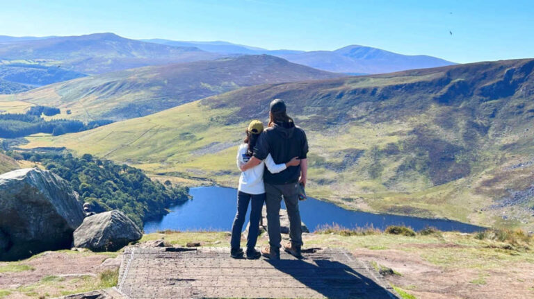 The author Abigail Bliss and her husband enjoying the overlooking view of Lough Tay in Wicklow Mountains National Park