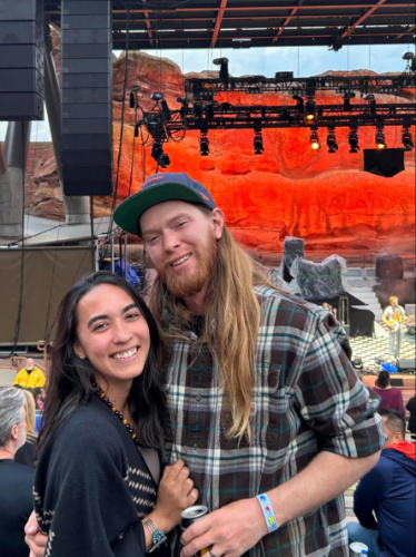 Travel Lemming Editor, Abigail Bliss and her husband, posing for a photo at Red Rocks Amphitheatre