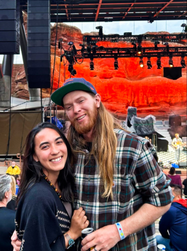 Travel Lemming Editor, Abigail Bliss and her husband, posing for a photo at Red Rocks Amphitheatre