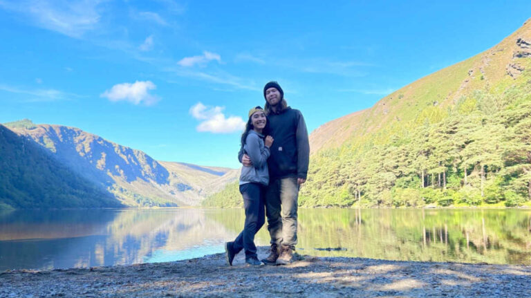 The author Abigail and her husband with the scenic view of Wicklow Mountains National Park