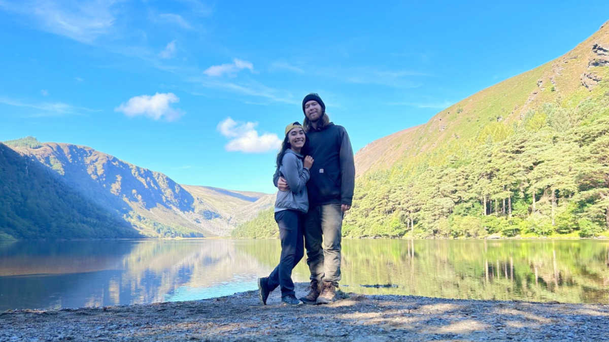 The author Abigail and her husband with the scenic view of Wicklow Mountains National Park