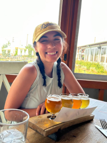 Travel Lemming editor, Abigail Bliss smiling for a photo at Breckenridge Brewery