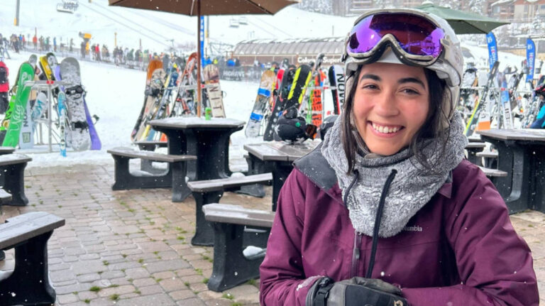 The author Abigail smiling for a photo at the Breckenridge Ski Resort