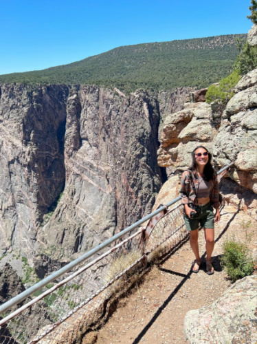 Author Abigail standing at a lookout in Black Canyon of the Gunnison
