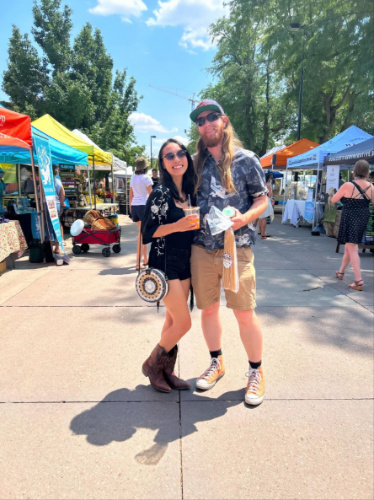 Travel Lemming editor, Abigail Bliss with her husband in Boulder Farmers Market