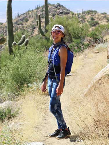 Abigail Bliss smiling for a photo in Saguaro National Park