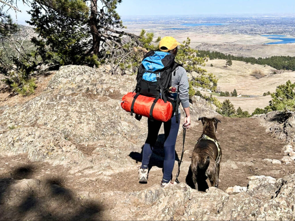 The author, Abigail, carrying the Teton Sports Scout Backpack with her dog on a hike