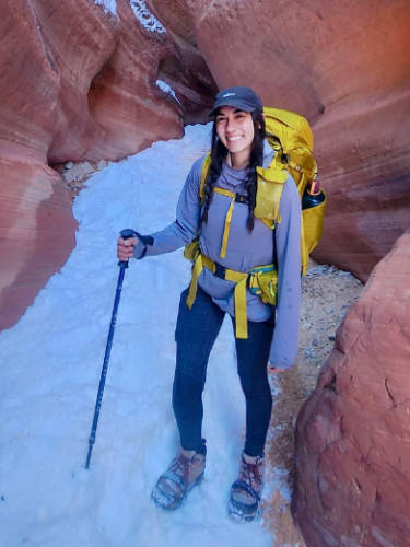 The author smiling for a photo during a trek using REI Co-Op Flash 55