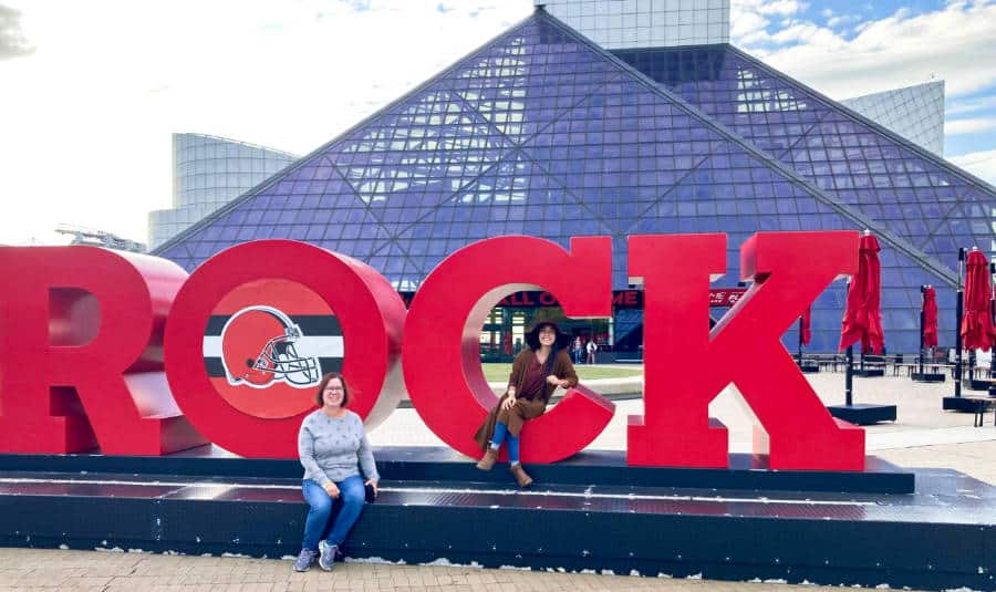 Travel Lemming Editor Abigail and her mom posing outside the Rock and Roll Hall of Fame