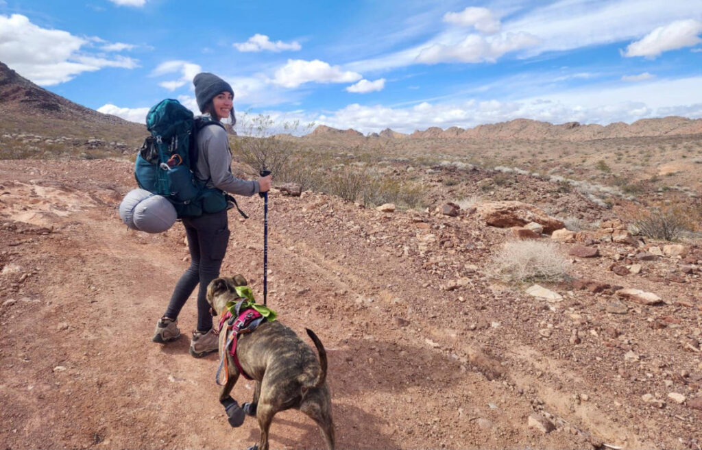 Abigail with her dog and her Osprey Eja Backpack
