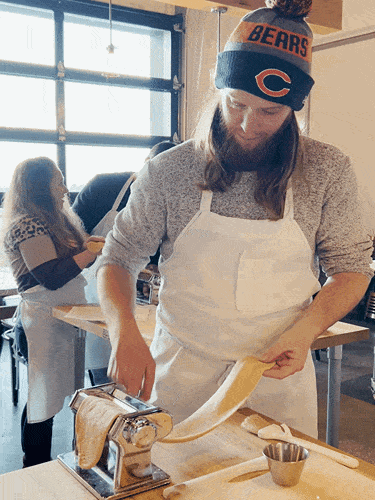 Travel Lemming editor Abigail Bliss' husband rolling out the cannoli dough during a cooking class at Uncorked Kitchen & Wine Bar