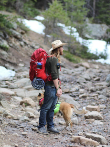The author's husband and dog on a backpacking trip