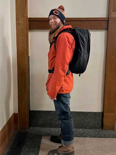 Abigail's husband carrying the Tortuga Travel Backpack