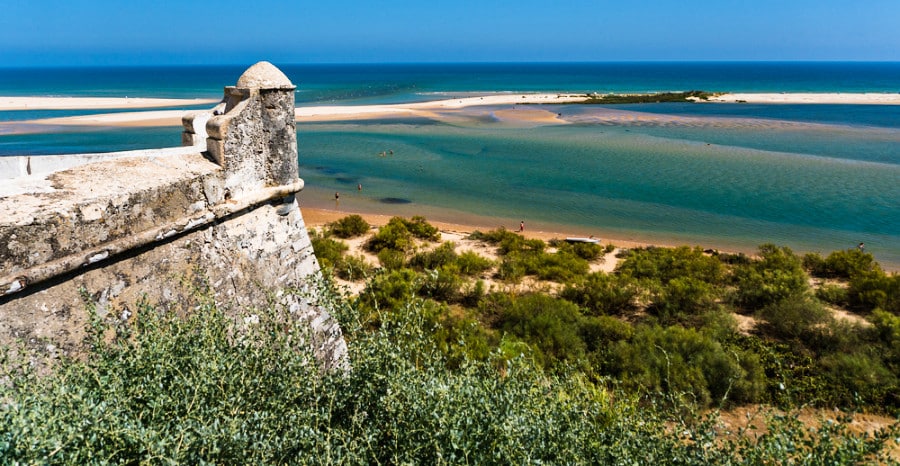 View of the sandbar in the clear blue water of Tavira Beach from Cacela Velha