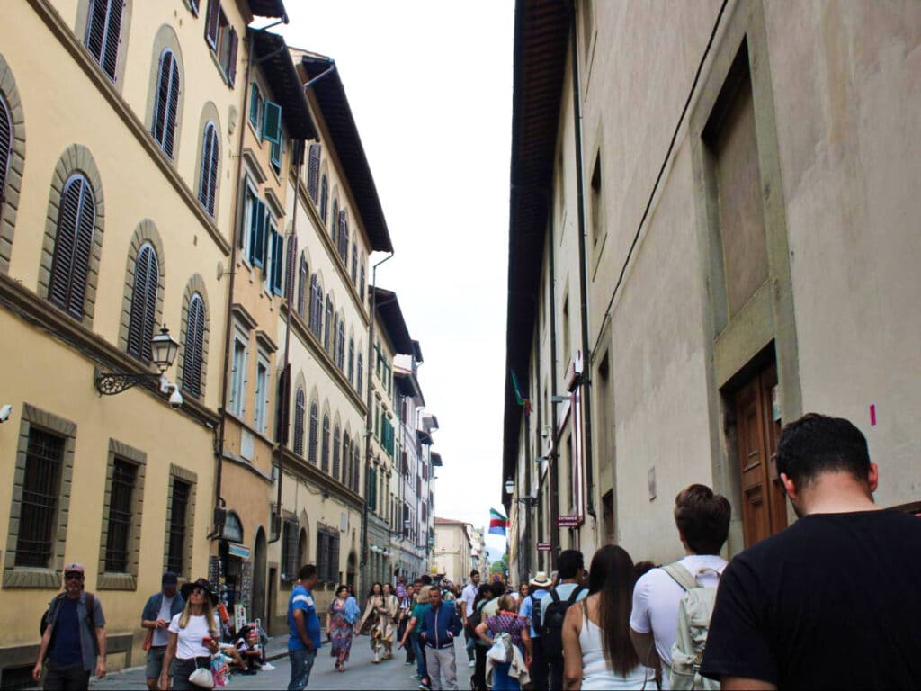 View of the crowd waiting in line outside the Accademia Gallery in San Marco