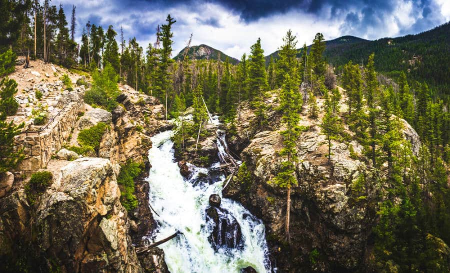 View of the cascading Adams Falls in Rocky Mountain National Park on a cloudy day