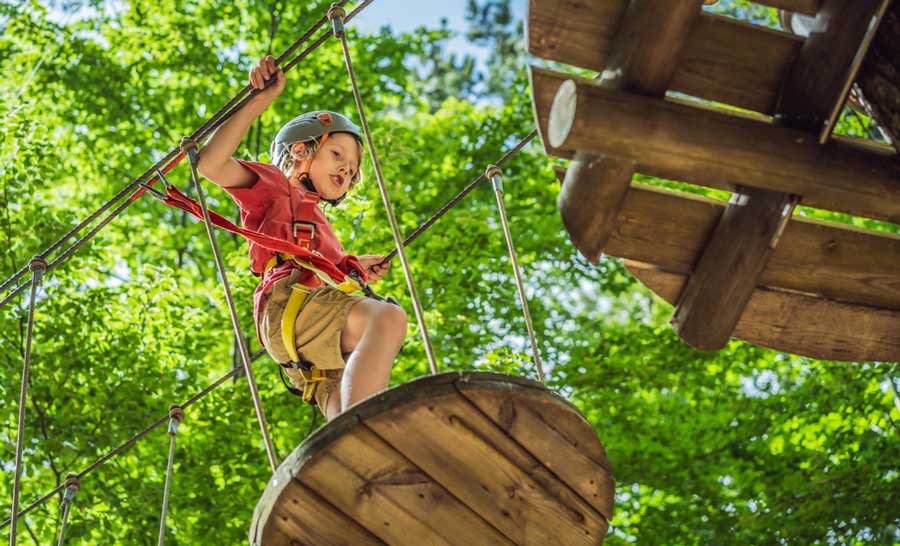 A kid enjoying his day in Adventure Center of Asheville