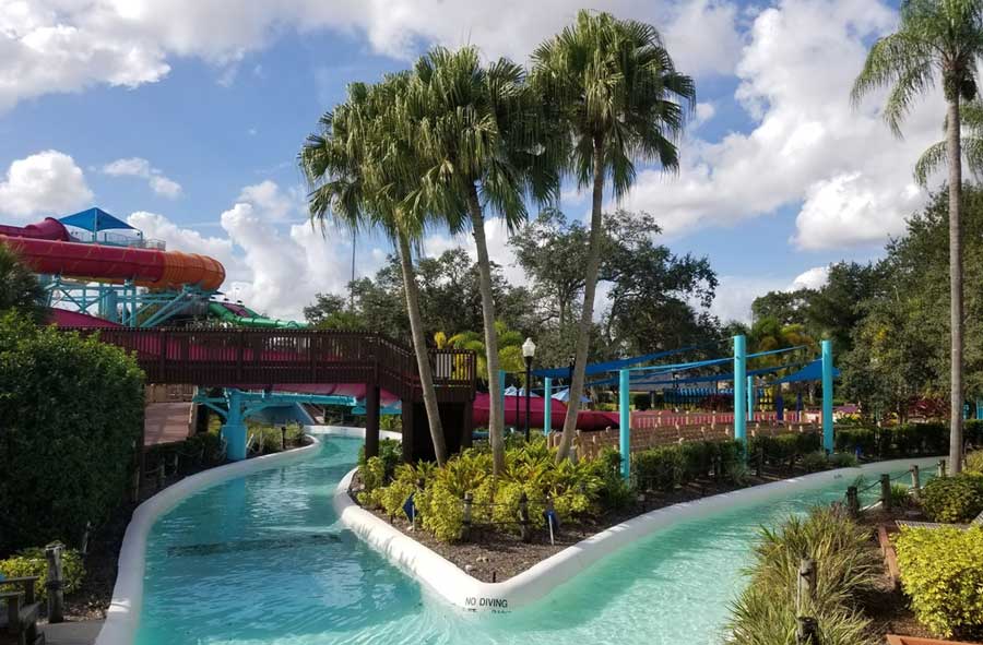 A huge colorful tube side view from the clear v-shaped pool in Adventure Island