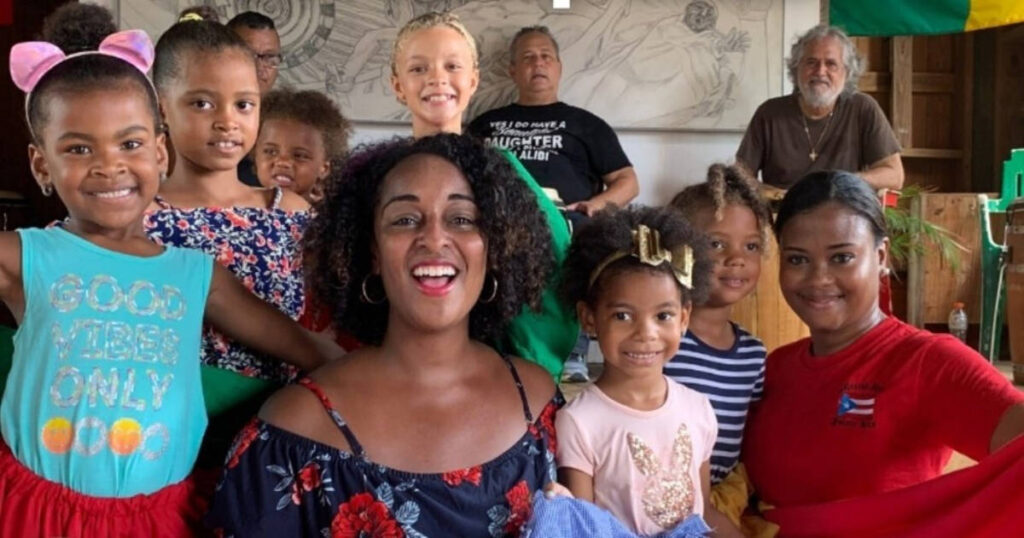 A group of Afro ancestral smiling for a photo