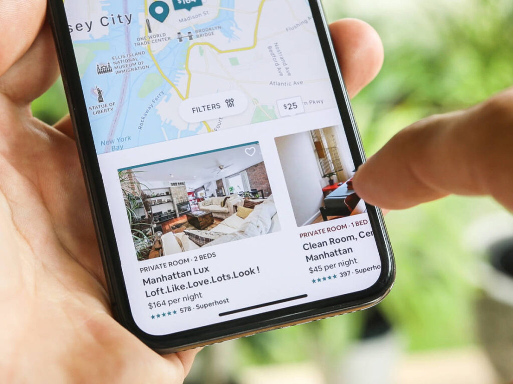 Browsing rooms on the AirBnb app on a phone