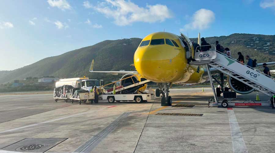 People going inside an airplane in USVI