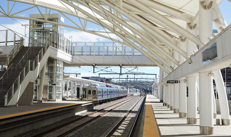 View of an incoming train on a train station in Denver
